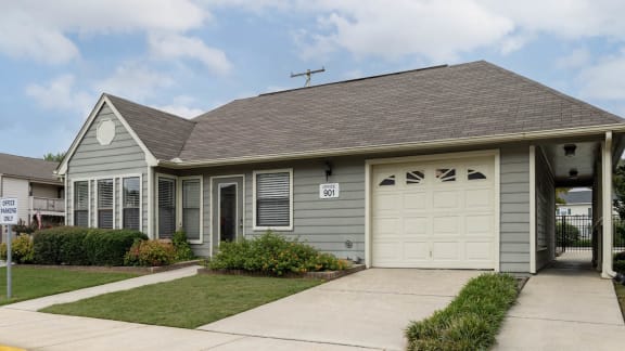 a gray house with a white garage door