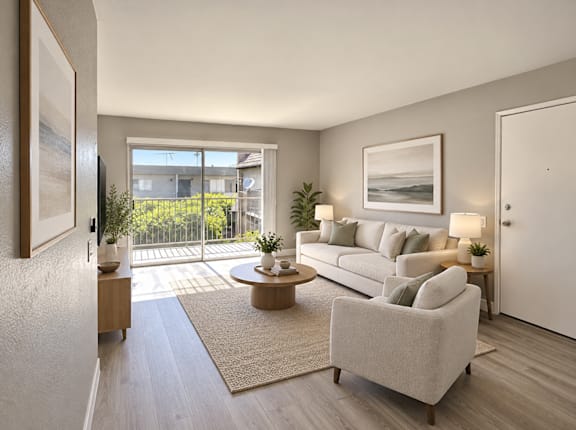 A modern living room with a large window and a view of the outdoors.