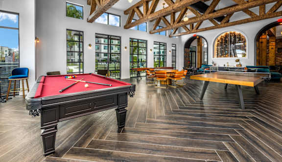 Game room with pool table at clubhouse at The Alibi at Lake Lilly, Florida, 34761