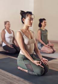 a group of women practicing yoga in a yoga class at The Mark, San Antonio, TX