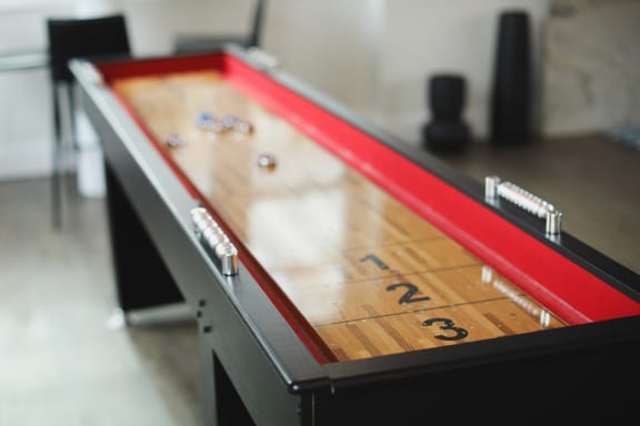 a red and black pool table with the number 23 on it