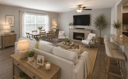 A living room with a fireplace and a television.