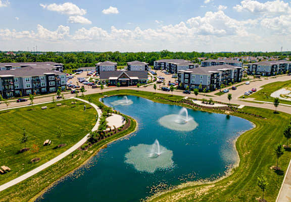 A large body of water with two fountains in the middle of it.