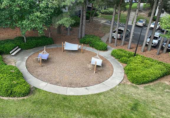 a seating area in a park with benches