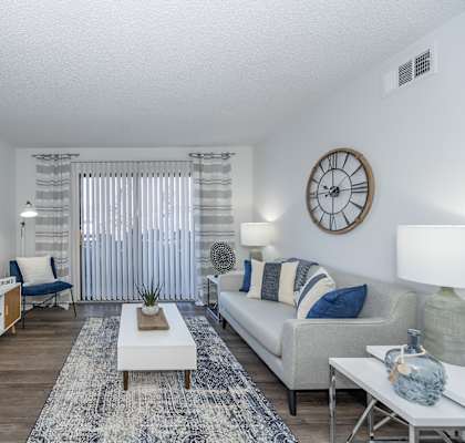 our apartments offer a living room with a couch and a tv