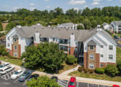 Thumbnail 13 of 14 - Swift Creek Commons Apartments - Exterior with parking