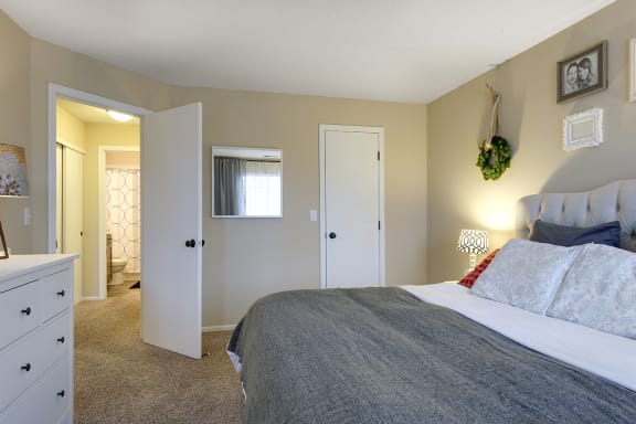 a bedroom with a bed and a closet  at Regency Woods, Minnetonka, MN, 55305