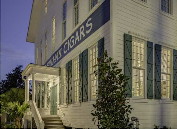 the facade of the cigar company building at night