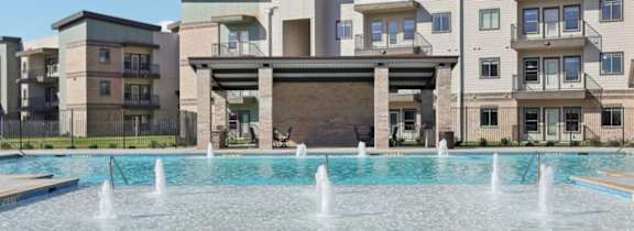 A large house with a pool in front.