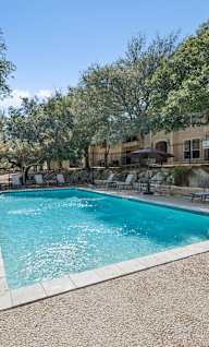 pool surrounded by  chairs at Crosspoint Oaks at Boerne, Texas