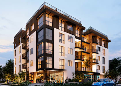 A modern apartment building with balconies and a blue car parked in front.