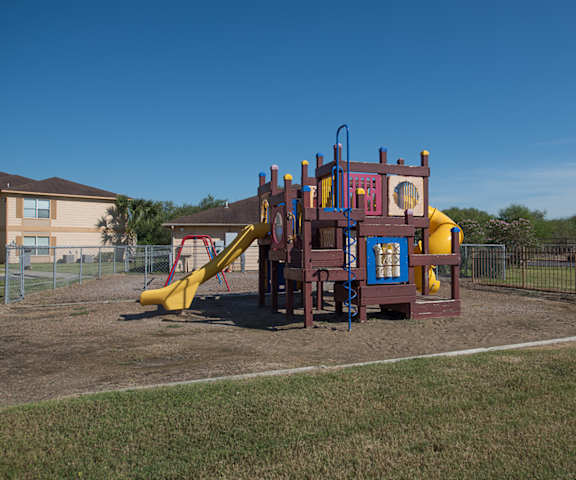 a playground with a playset in a yard