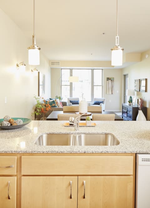 Kitchen and Living Room at The Cambric Senior Apartments, St. Paul, MN 55106