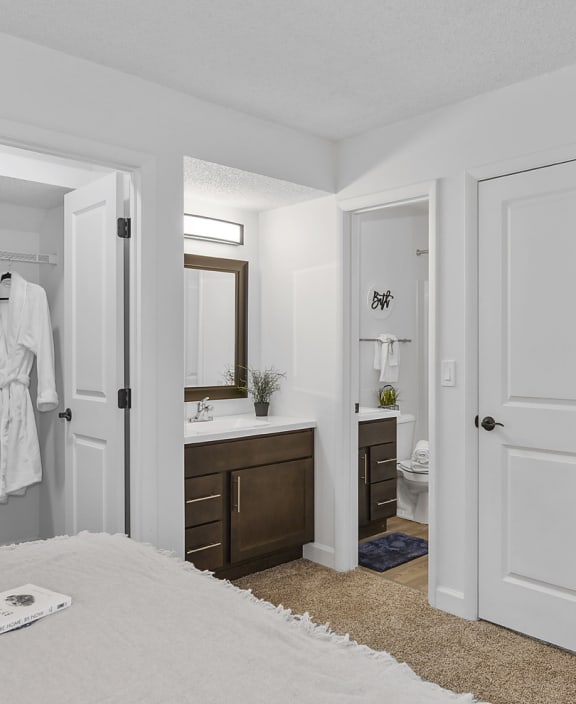 a bedroom with a bed and a mirror and a bathroom at Weaver Farm, Florence, 41042