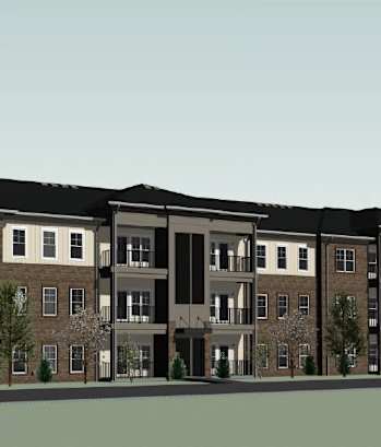 A large apartment building with multiple balconies and doors.