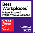 A purple and white sign that says Best Workplaces in Real Estate & Property Development.