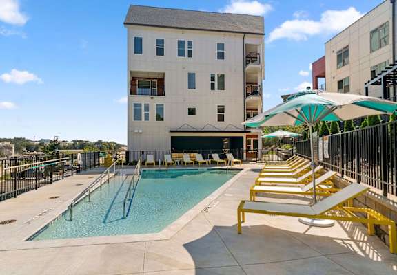 our apartments have a resort style pool with lounge chairs