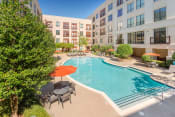 Thumbnail 4 of 12 - Lofts at Lakeview Apartments - Resort-style swimming pool