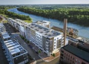 Thumbnail 11 of 35 - an aerial view of an apartment complex with a river in the background at East 51 At Rocketts Landing, Richmond, 23231