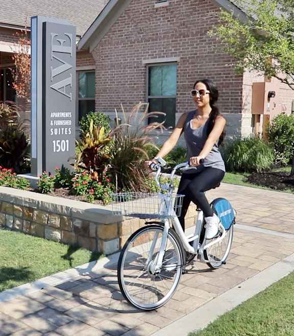 Woman Riding A Bicycle at AVE Somerset