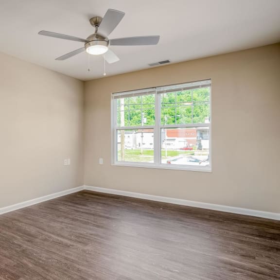 a dining room with a table and chairs and a bookshelf