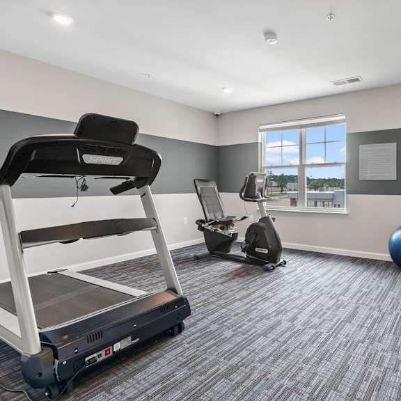 the retreat at thousand oaks fitness room with treadmill and exercise balls