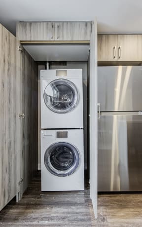 a small laundry room with a washer and dryer