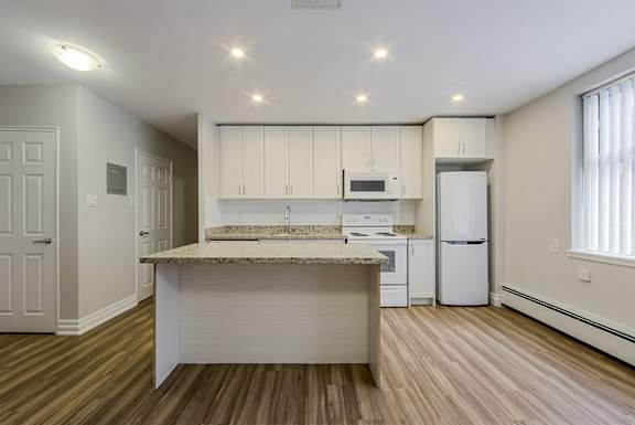 A kitchen with a countertop and cabinets.at 107 Redpath, Toronto, M4S 2J9