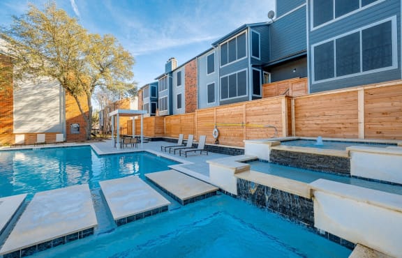 The Monet Apartments in Dallas, Texas Pool Area with Lounge Chairs and Fountain