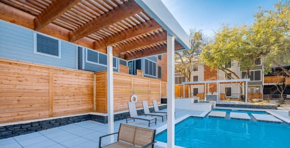 The Monet Apartments in Dallas, Texas Pool Area with Lounge Chairs