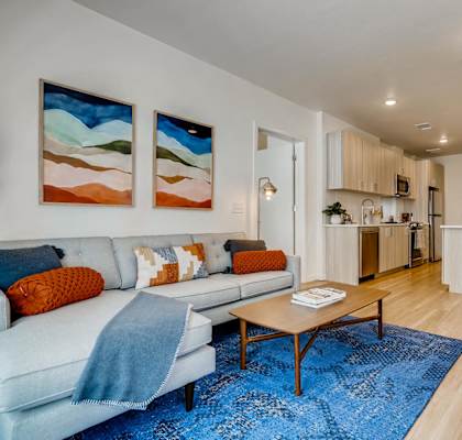 a living room with a couch and a table