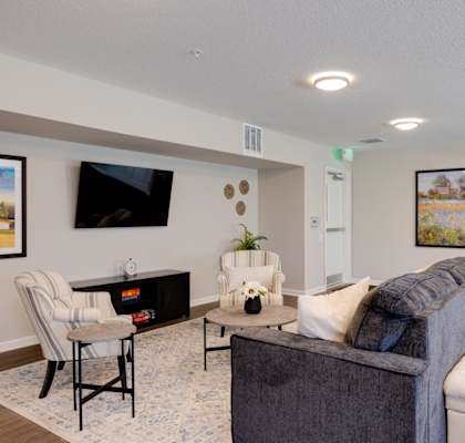 a living room with couches and chairs