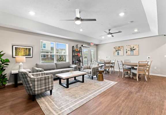 a living room with a couch and a dining room table