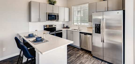 Gourmet Kitchen with Island at Avilla Buffalo Run, Commerce City, CO 80022