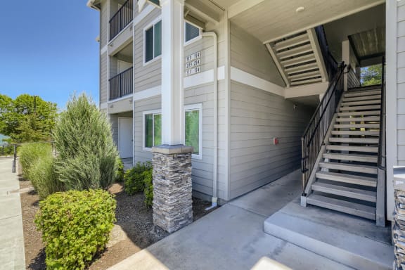 An apartment building and outdoor staircase at Huntington Place Apartments