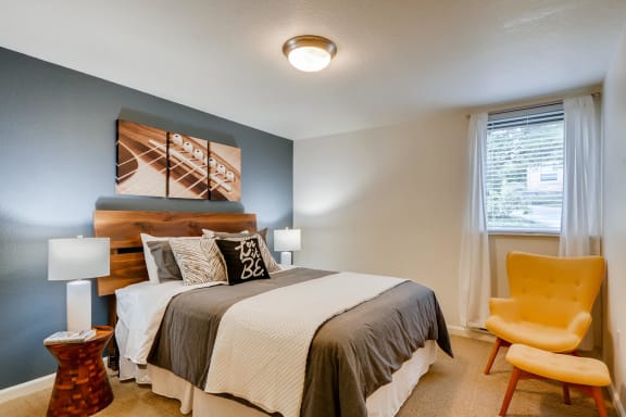 Three Bedroom Apartments in Happy Valley, OR - Sunnyside Village Apartments Large Bedroom with Carpet Flooring and Window