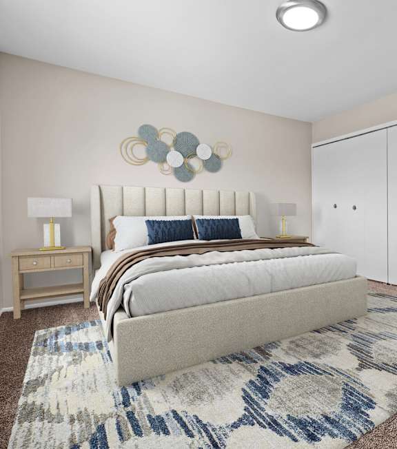 A bedroom with a bed, nightstand, and a rug.