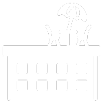 A black and white image of a table with chairs and an umbrella on it.