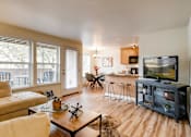Thumbnail 1 of 34 - Apartments for Rent in Happy Valley - Sunnyside Village - Living Room with Open-Concept Floorplan, Wood Flooring, and Glass Patio Door