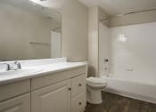 Thumbnail 24 of 26 - Full bath with white cabinets and countertops