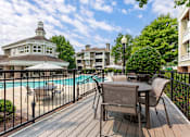 Thumbnail 29 of 30 - Poolside Dining Tables at The Apartments at Tamar Meadow, Columbia, MD
