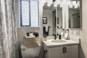 Thumbnail 14 of 19 - Bathroom With Vanity Lights at Reedhouse Apartments, Boise, ID, 83706