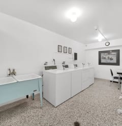 a laundry room with a sink and washer and dryer