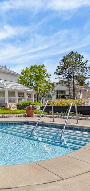 A large house with a pool in the backyard.
