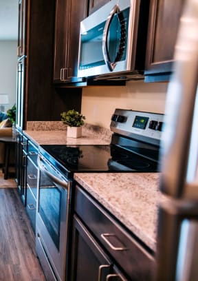 a kitchen with microwave sink and table