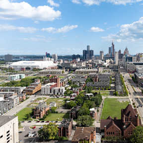 a view of a street in a city with tall buildings