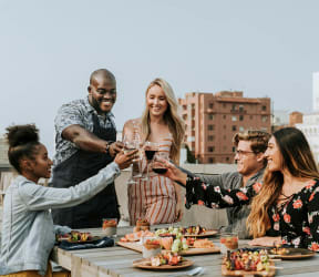 a group of people celebrating with wine at a dinner table The Baxter in Los Angeles, CA 90028