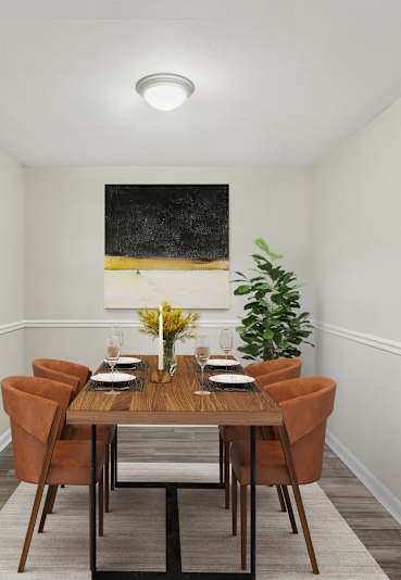 Apartments in Sandy Springs Georgia for Rent – Celebration at Sandy Springs - A dining room with a wooden table and chairs.