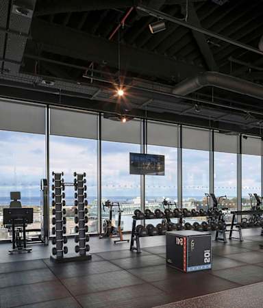 A gym with a view of the city.