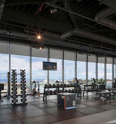 A gym with a view of the city.